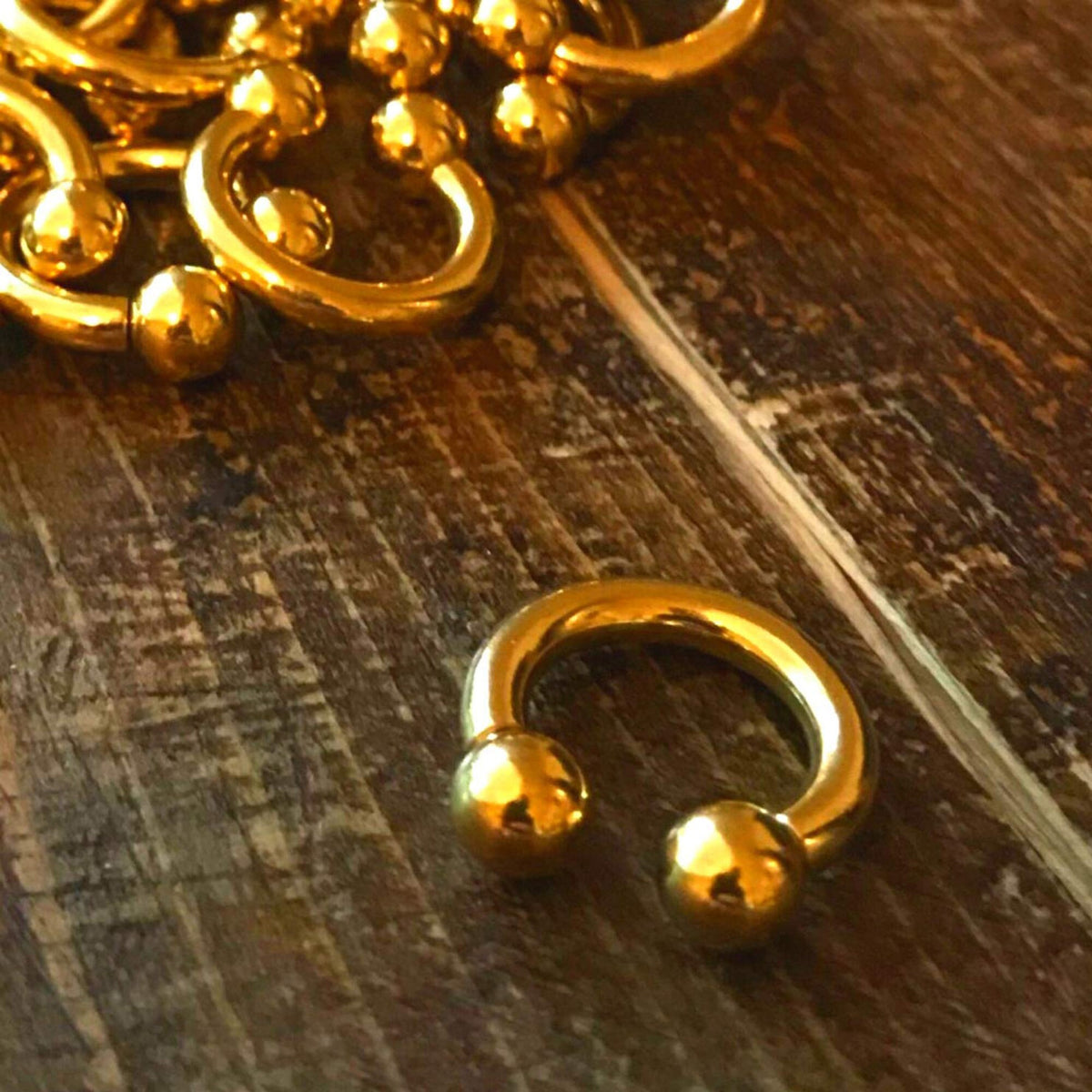 Gold Titanium Horseshoe Barbell: Internally Threaded Septum Ring (16G-00G)