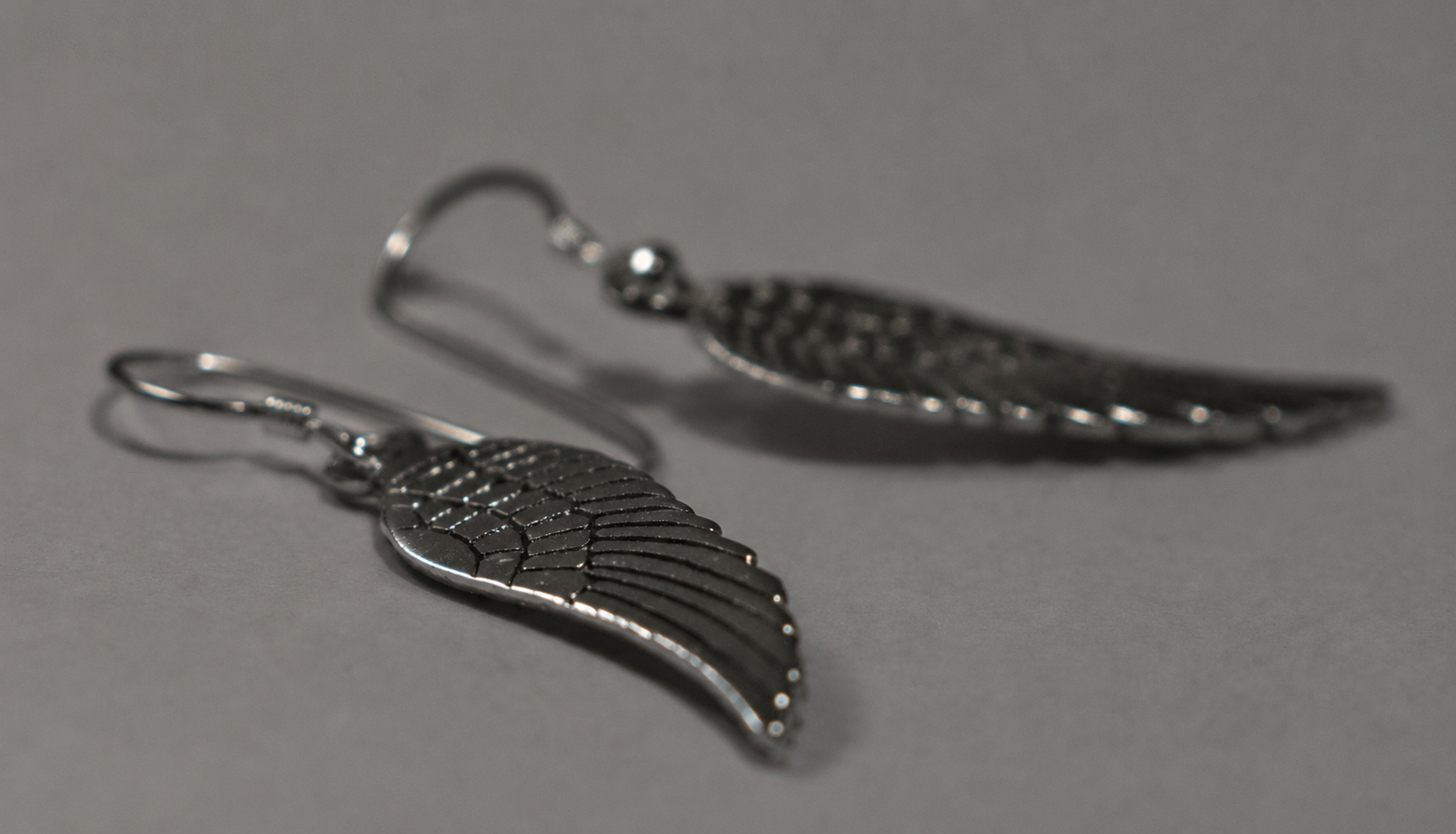 Angel wing sterling silver drop earrings